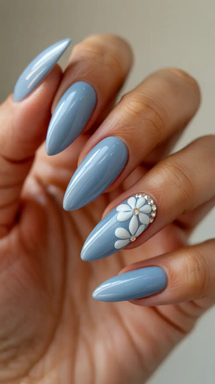 dreamy blue spring nails 2026 Dusty Blue Almond with Crystal Daisy Accent