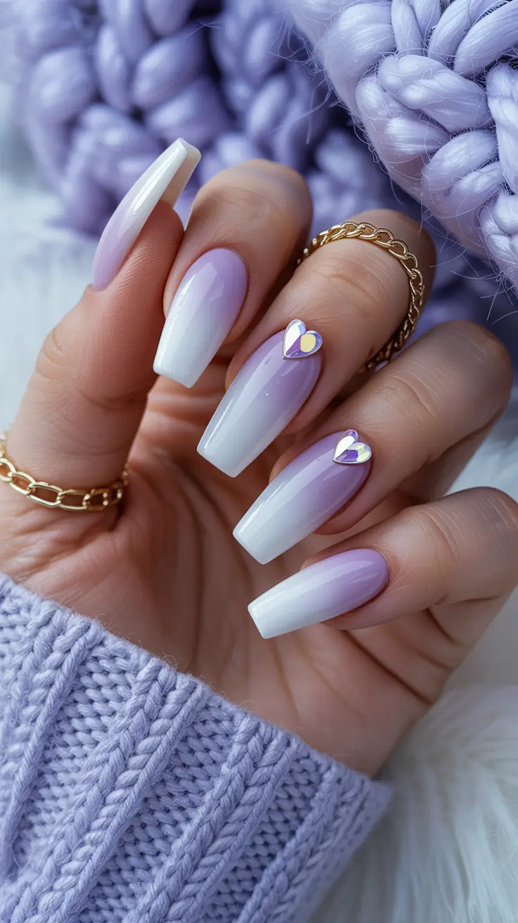 elegant white spring nails for 2026 Lavender White Blend With Delicate Heart Charms