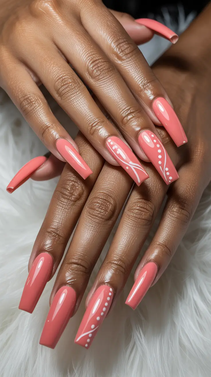 stylish spring nails for brown skin 2026 Coral Gloss With Delicate White Line Art - Playful Precision