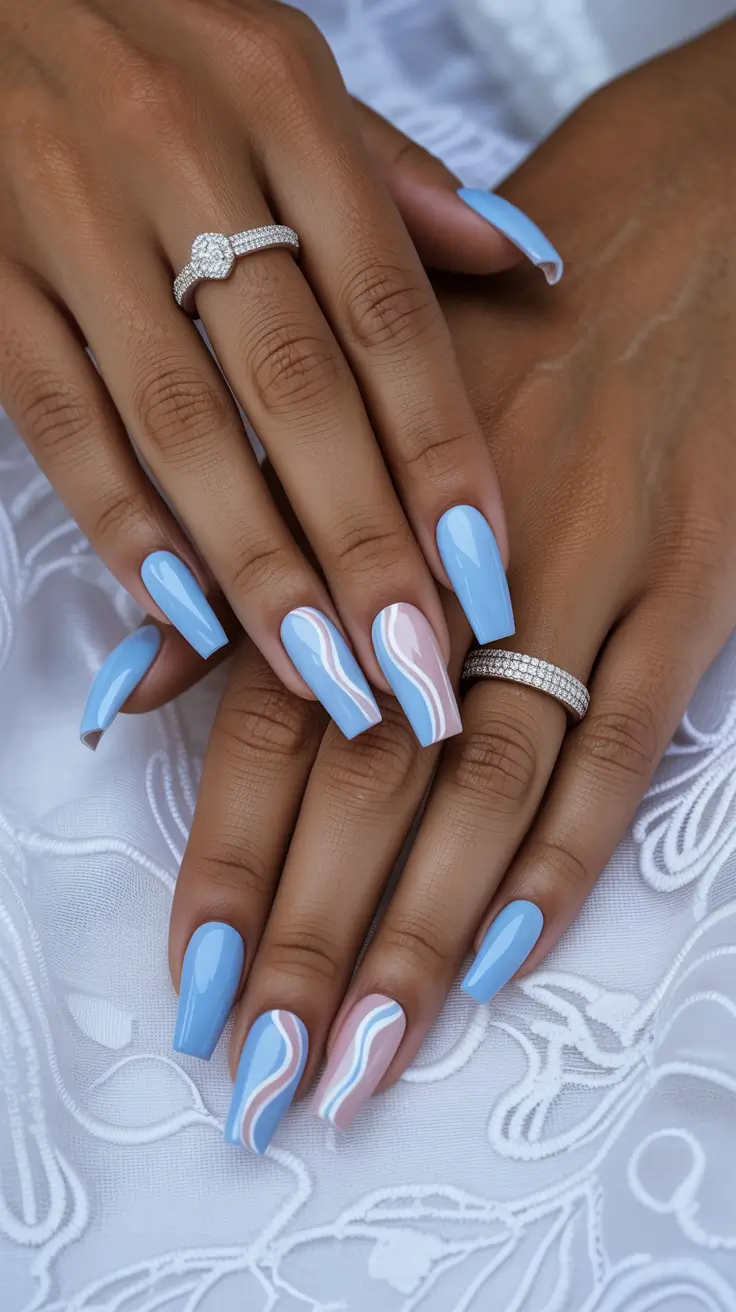 stylish spring nails for dark skin 2026 Baby Blue Coffin with Modern Swirl Art