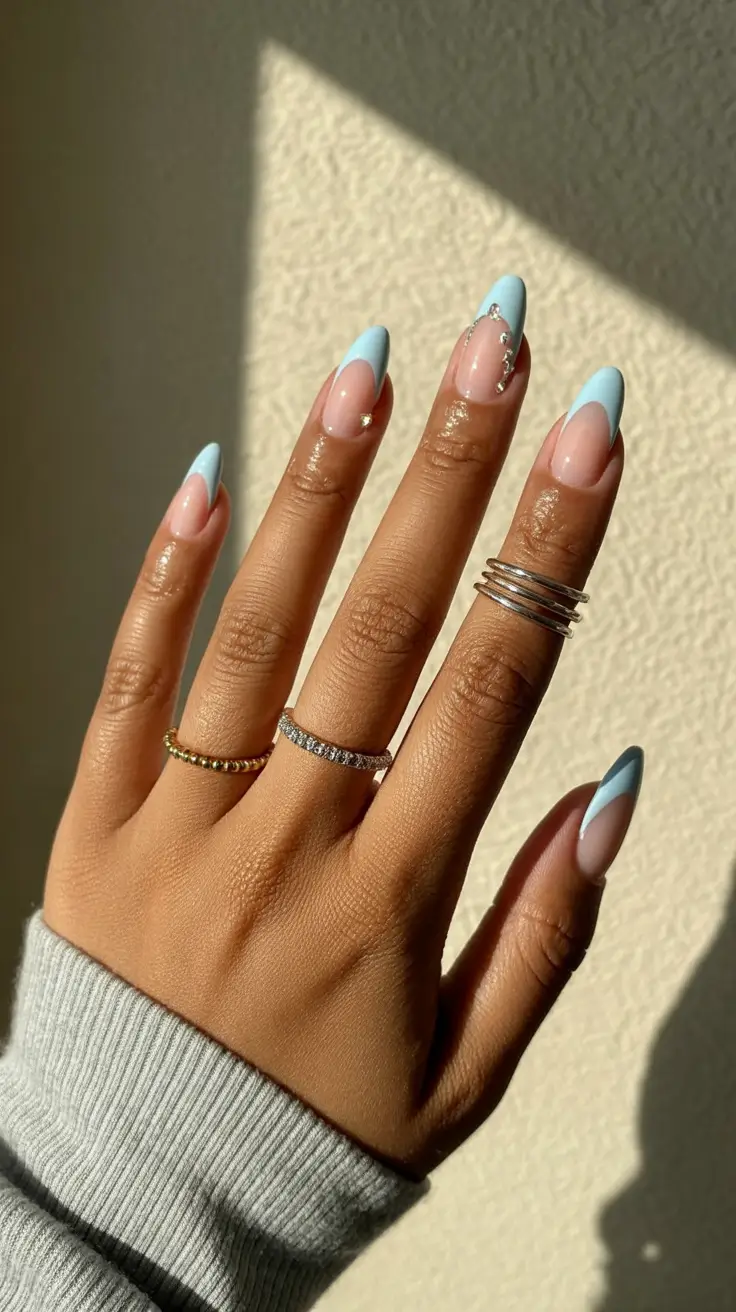 stylish spring nails for dark skin 2026 Sky Blue French Tips with Delicate Sparkle