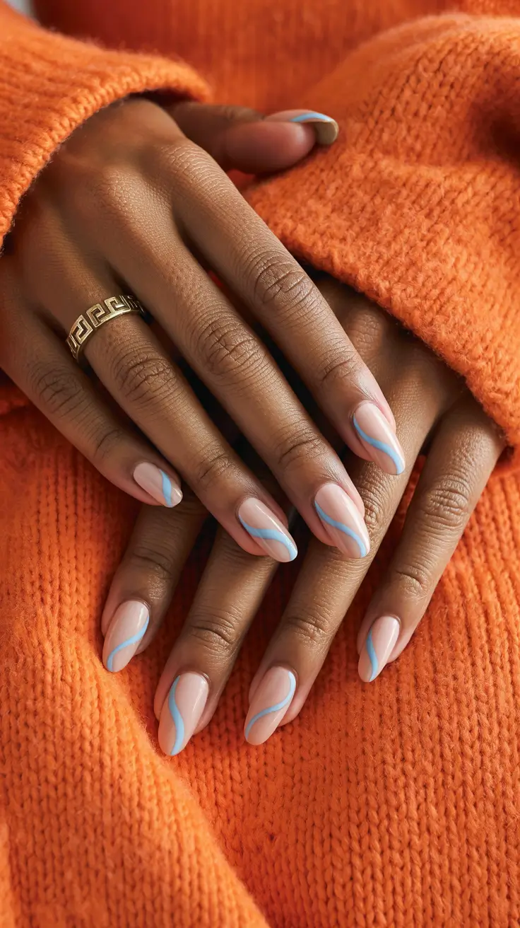 stylish spring nails for dark skin 2026 Soft Nude with Flowing Blue Accent Lines
