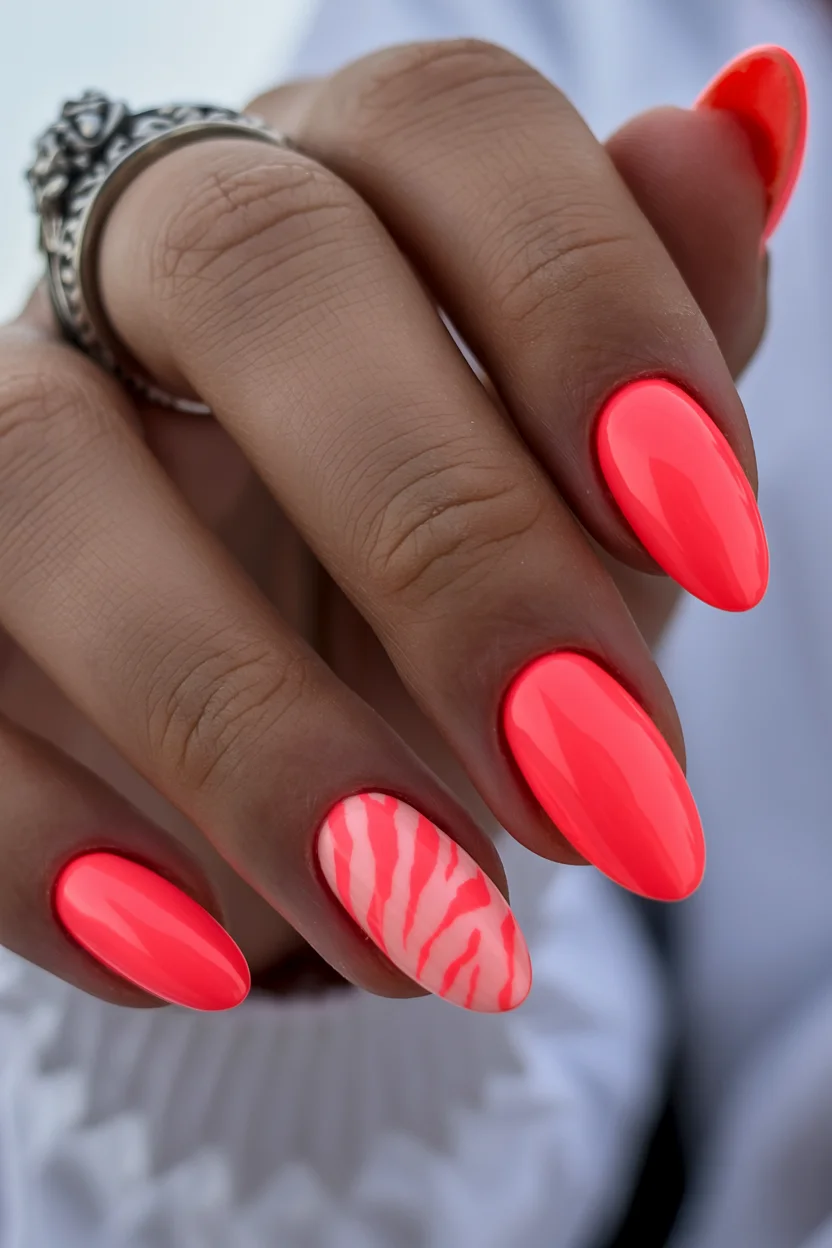 neon summer nails 2026 Coral Neon Nails With Zebra Accents for a Bold Late-Summer Mood