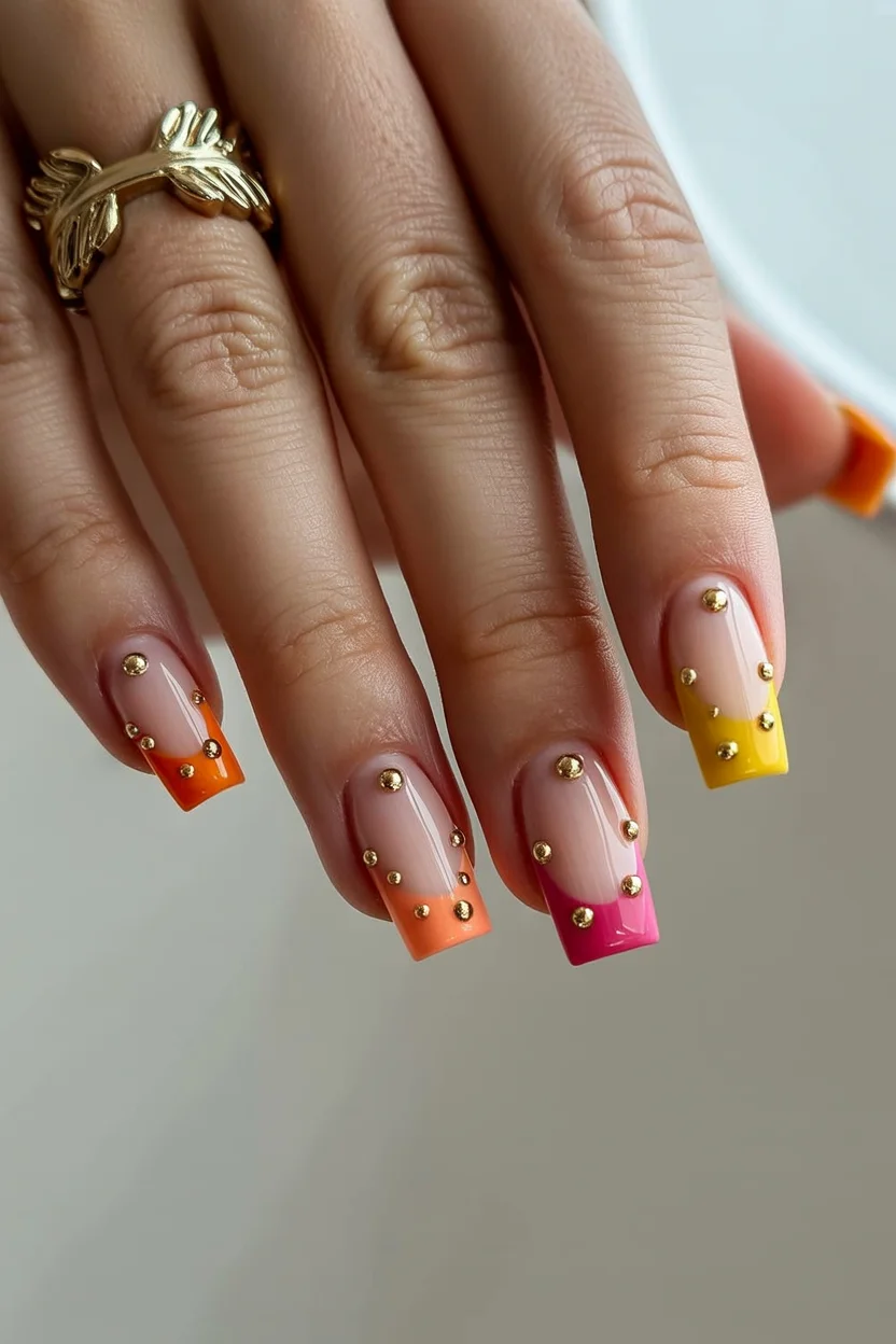 summer dip nails 2026 Sunset French Tips With Tiny Gold Stud Details