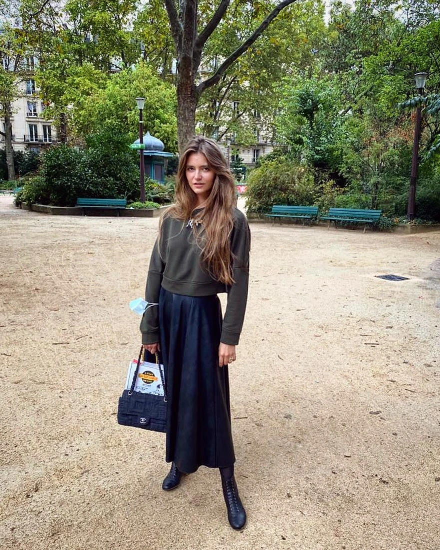 comfy fall outfits 2026 Olive Hoodie Styled With a Feminine Midi Skirt