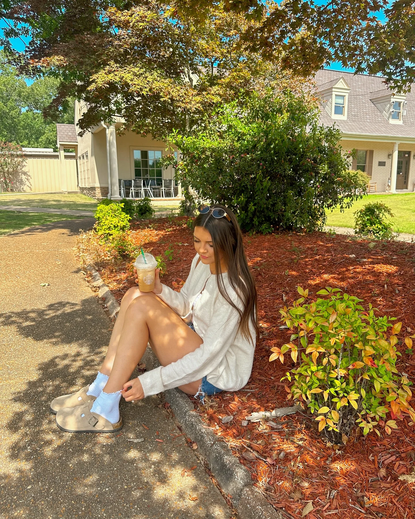 early fall outfits 2026 Oversized Sweater and Denim Shorts for Warm Autumn Afternoons