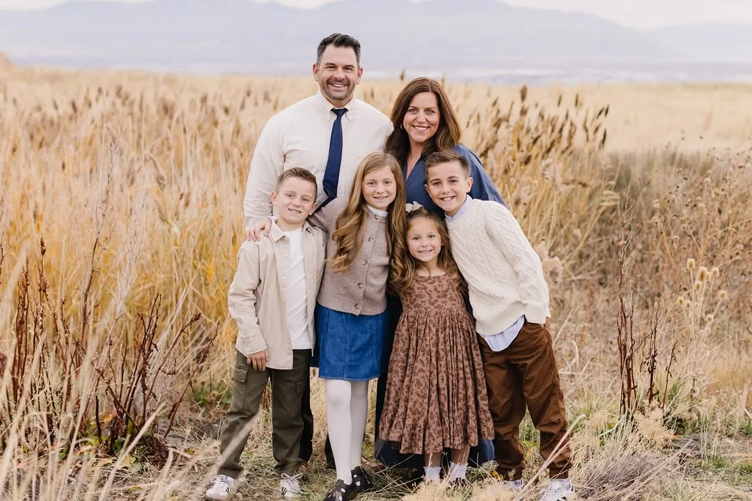 fall family picture outfits 2026 Soft Blue and Warm Neutrals for Elegant Countryside Portraits