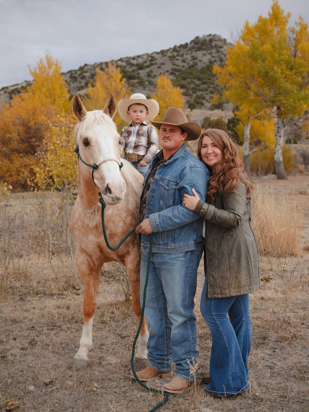 fall family picture outfits 2026 Western Denim and Cowboy Hats for Rustic Family Portraits