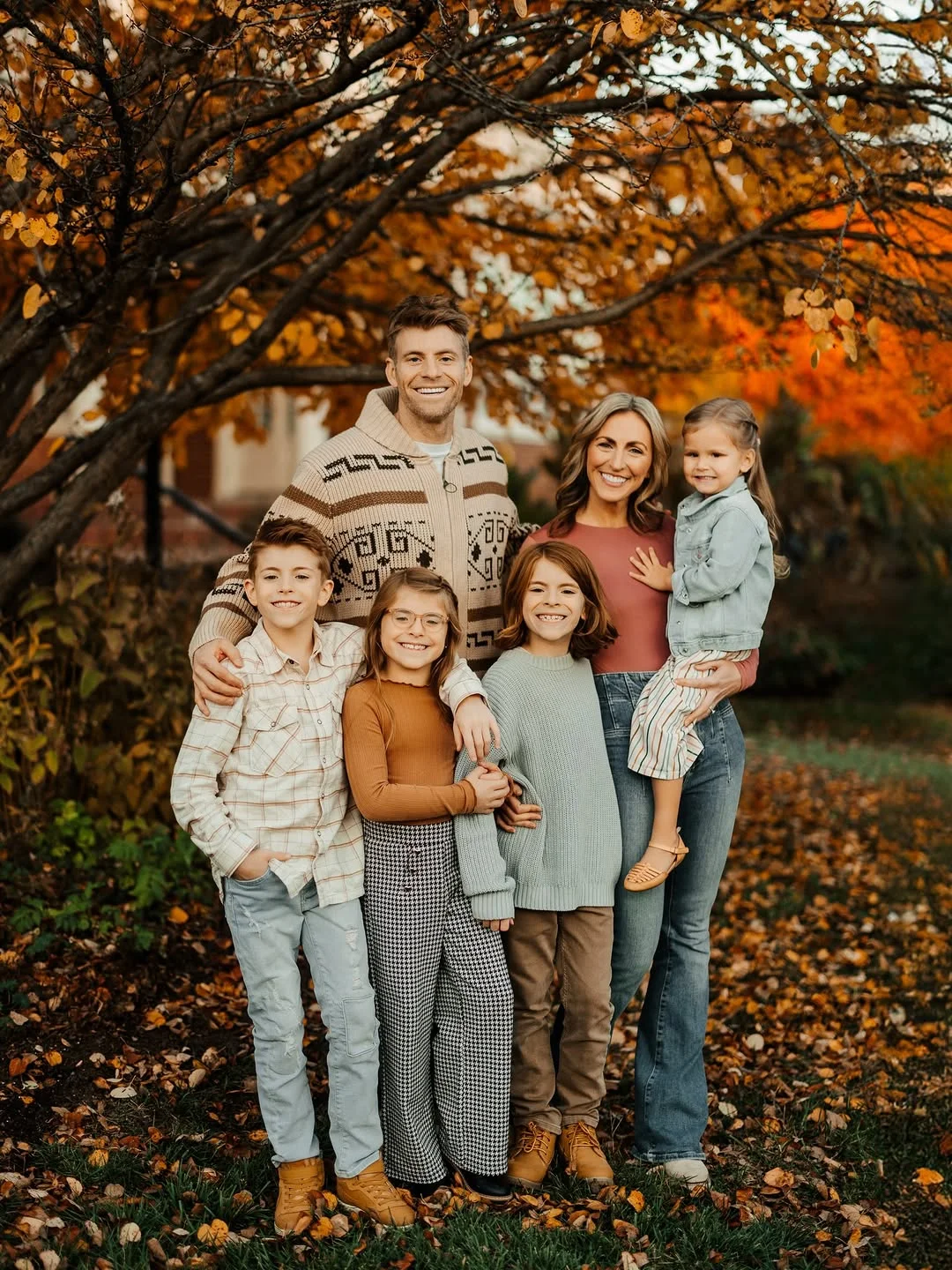 fall family picture outfits 2026 Cozy Nordic Knits with Denim for Colorful Fall Portraits