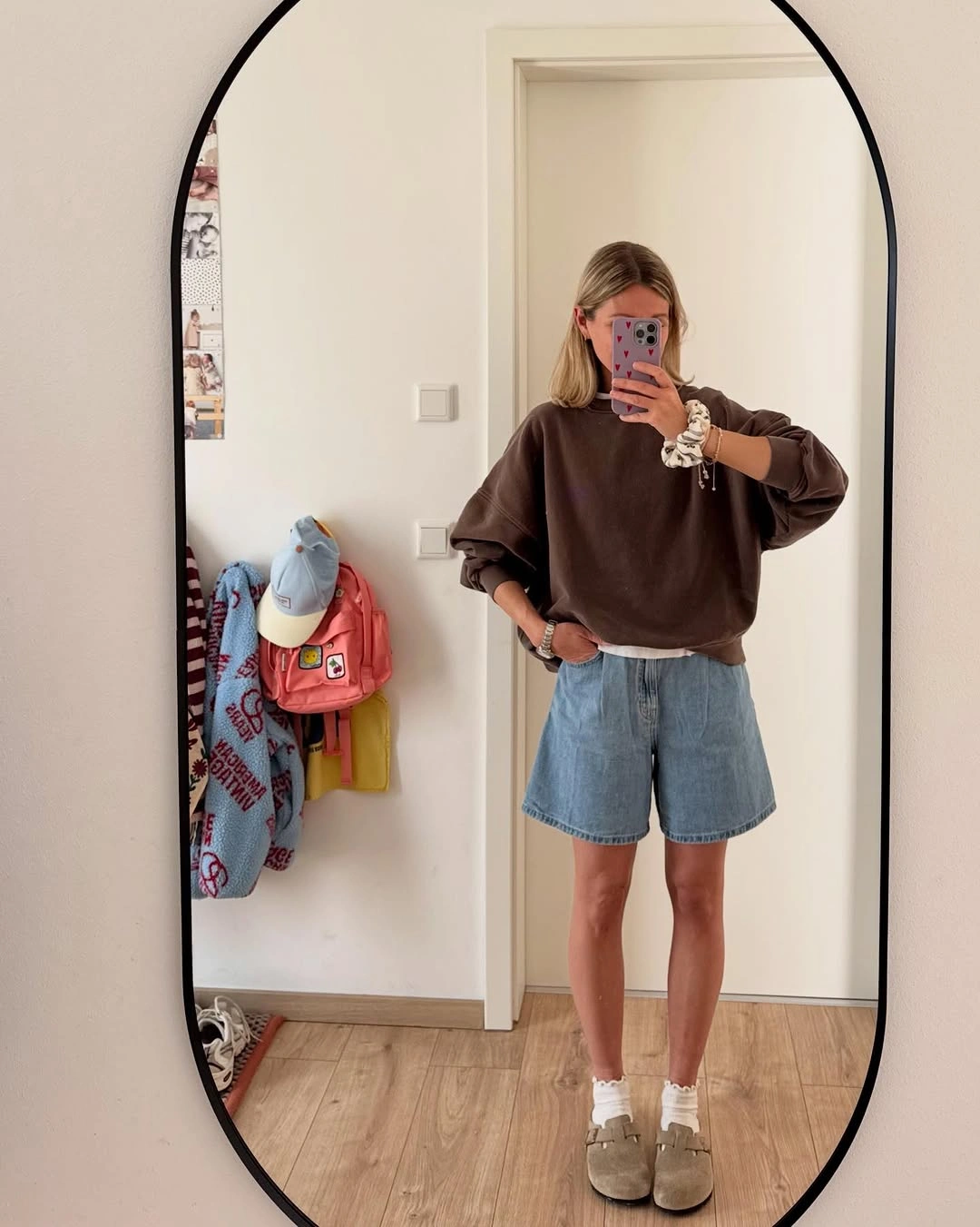 fall going out outfits 2026 Relaxed Sweatshirt and Denim Shorts for Warm Autumn Afternoons