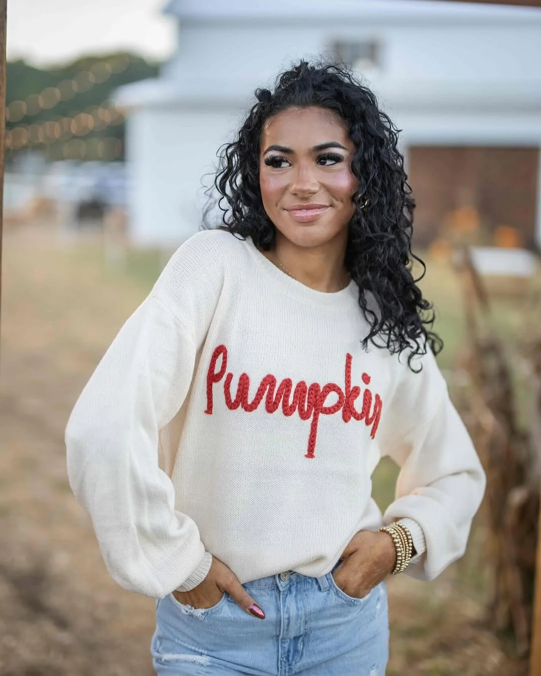 fall outfits with sweater 2026 A Playful Pumpkin Sweater That Brings Fall Energy