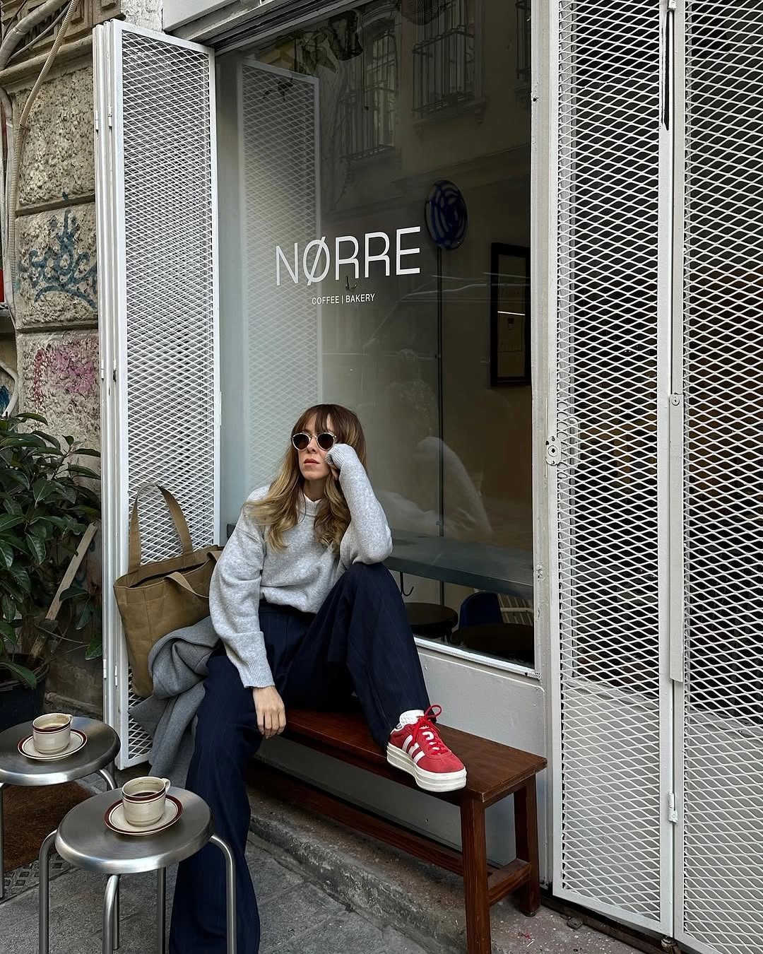 fall travel outfits 2026 Cozy Coffee Stop Style With Relaxed Knitwear And Sneakers