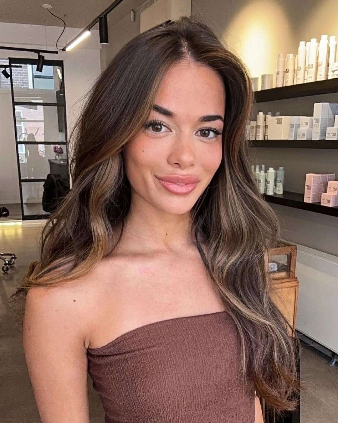 august hairstyles and color ideas 2026 Rich Brunette Waves With Face-Framing Highlights