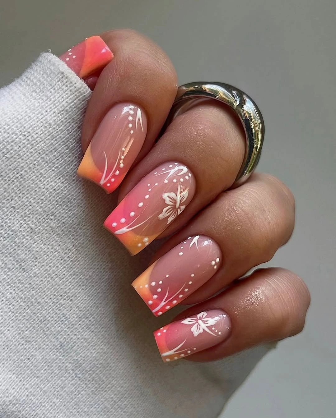 august nails color 2026 Sunset Ombre Blossoms with Soft Tropical Warmth