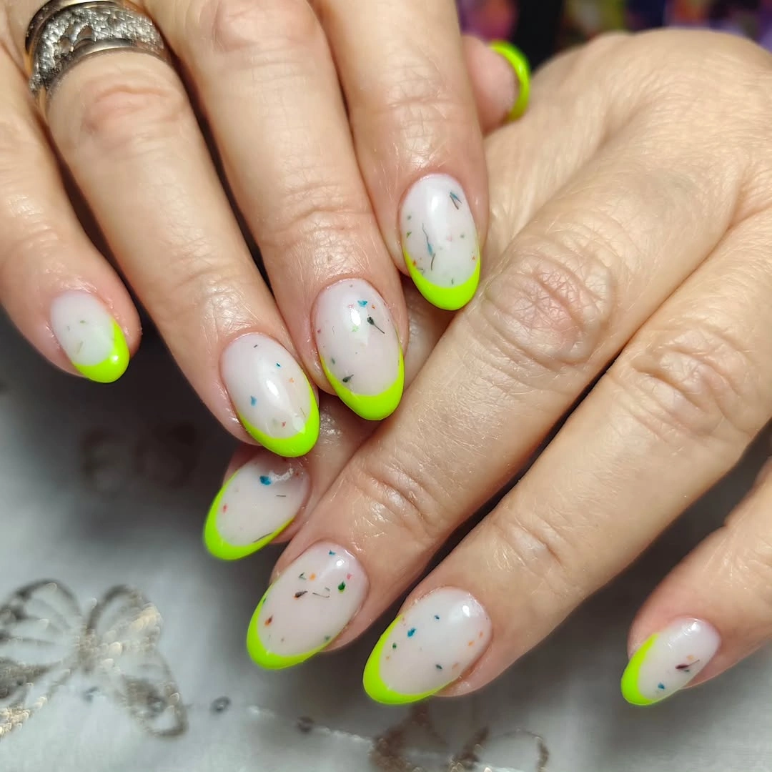 august nails ideas 2026 Neon Lime French Tips With Confetti Details