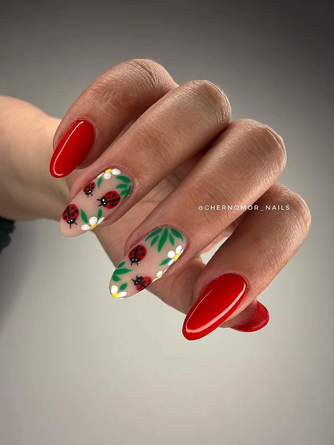 august nails ideas 2026 Ladybug Garden Nails With Vibrant Red Charm