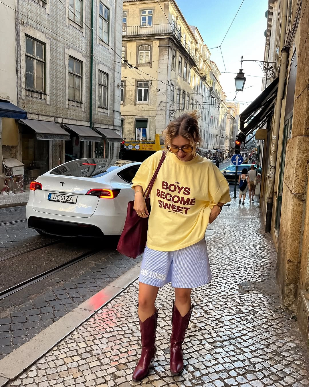 august outfits 2026 Playful Graphic Tees And Cowboy Boots For Late Summer Street Style