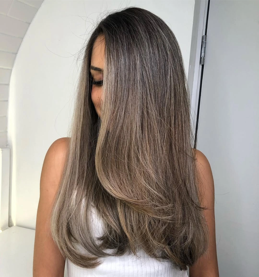 babylights hair ideas Long Espresso Hair with Soft Smoky Highlights