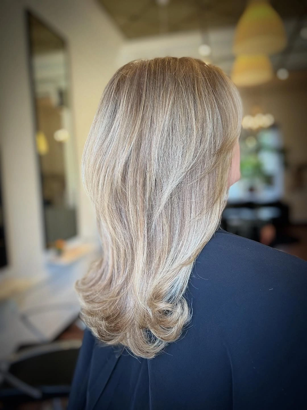 beige blond hair color Feathered Beige Blonde with Soft Flipped Layers
