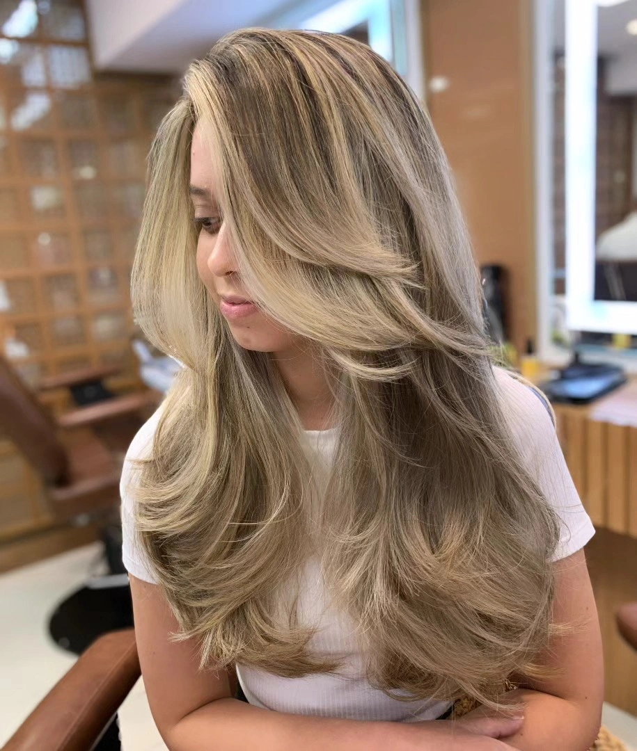 beige blond hair color Luxurious Beige Blonde Blowout with Dimensional Layers