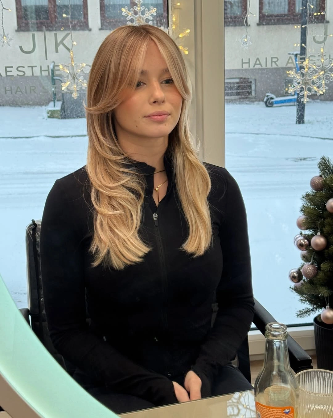 beige blond hair color Layered Beige Blonde with Curtain Bangs