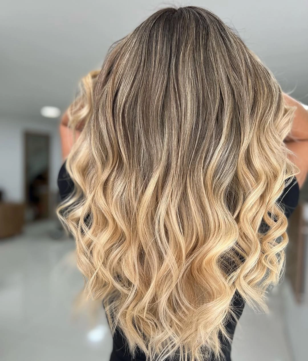 beige blond hair color Dimensional Beige Blonde Balayage with Lived-In Roots