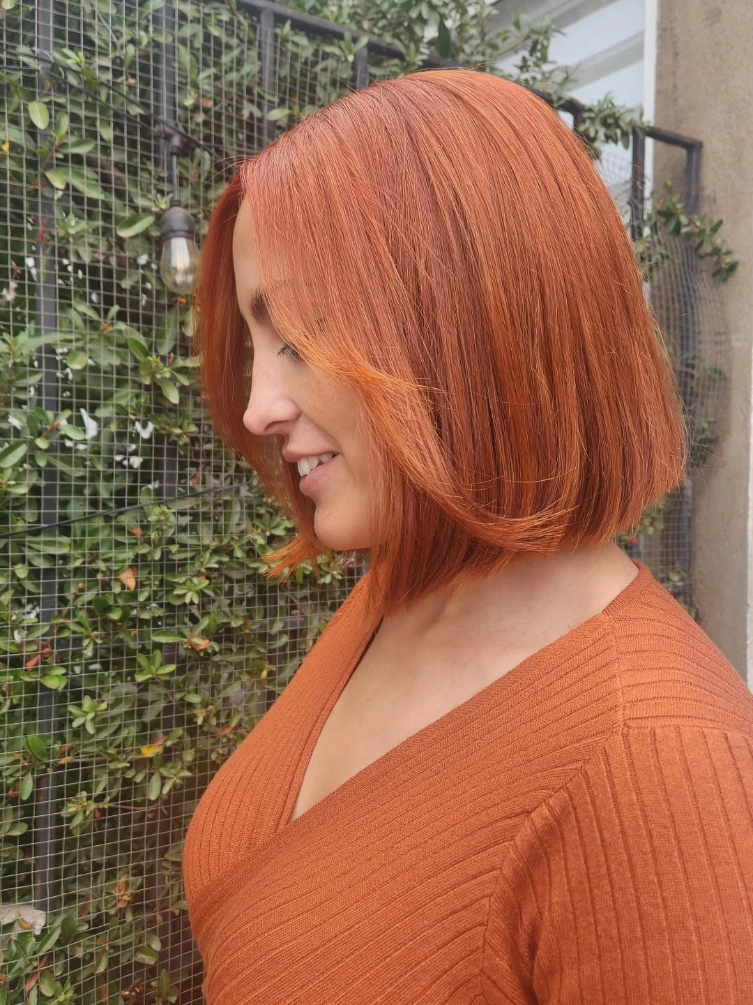 bobbed haircut for women Warm Copper Bob With Face-Framing Curtain Layers
