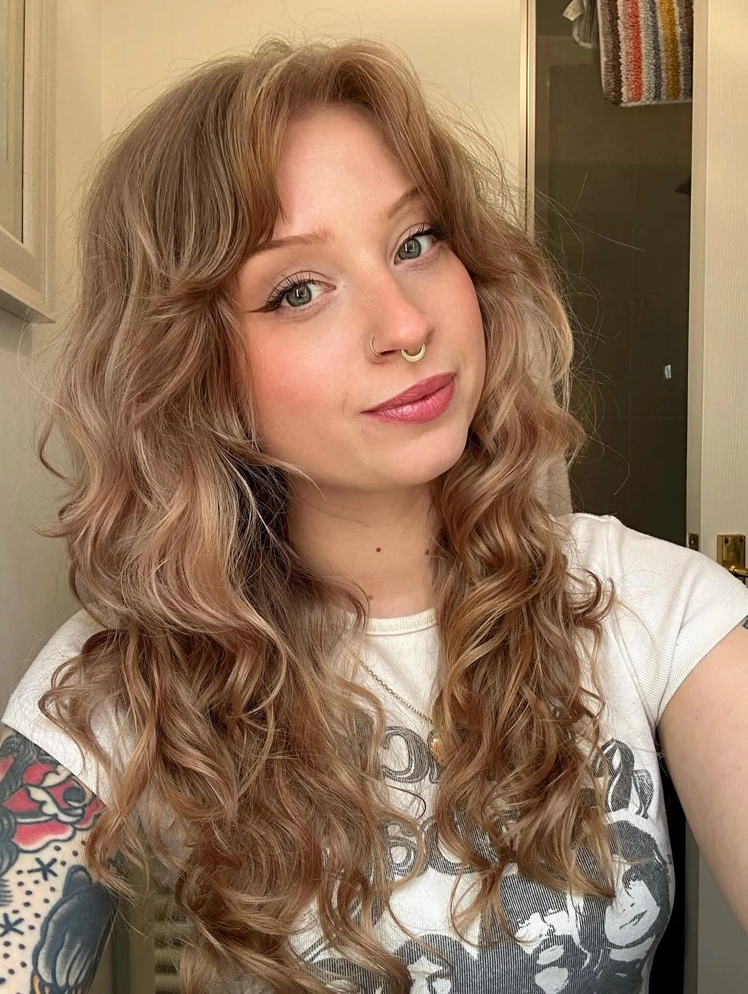 body waves hairstyle Soft Vintage-Inspired Waves With Wispy Bangs