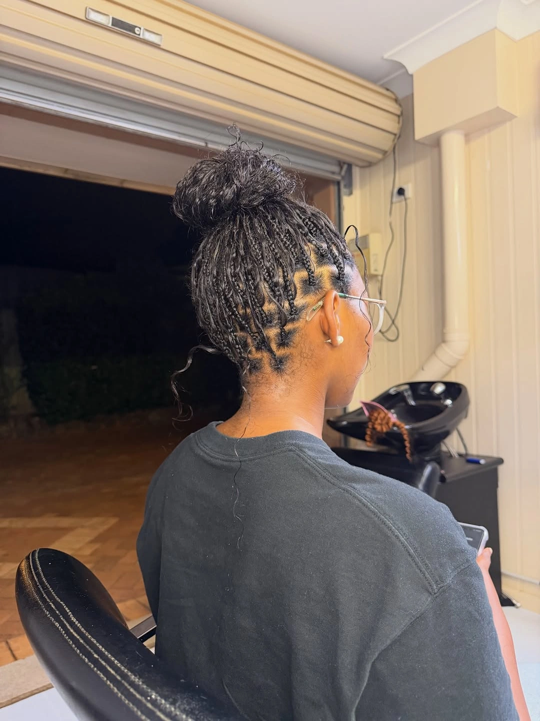 bora bora braids hairstyle Elegant High Bun with Detailed Scalp Braiding