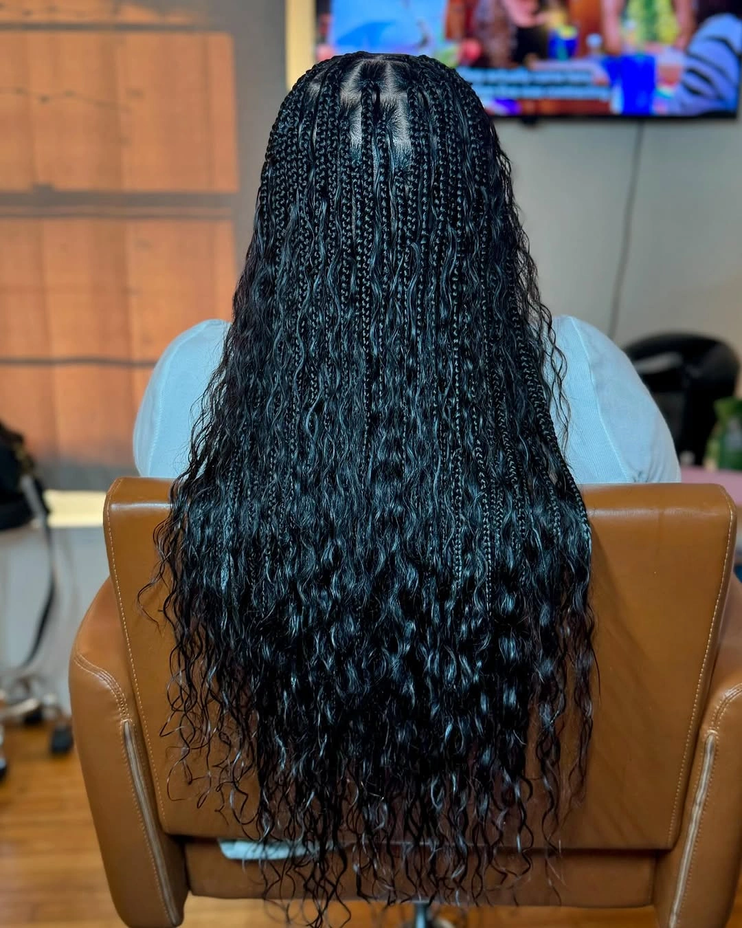 bora bora braids hairstyle Glossy Black Waves with Minimalist Elegance