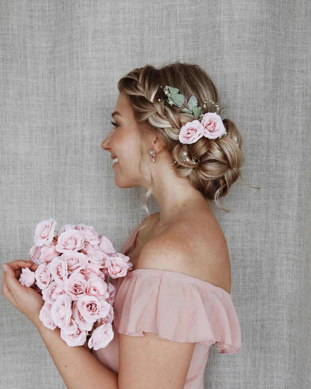 bridesmaid hairstyling Garden-Inspired Braided Updo with Fresh Floral Romance