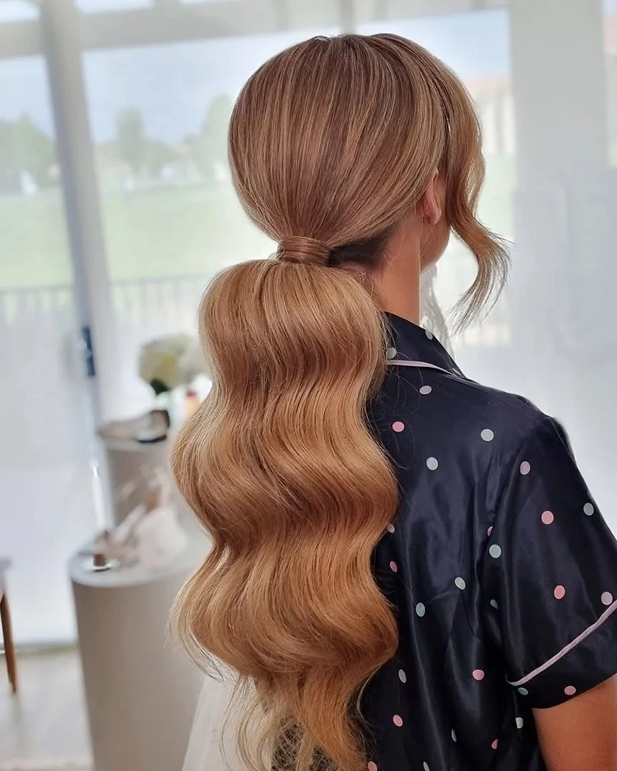 bridesmaid hairstyling Polished Low Ponytail with Soft Glamour