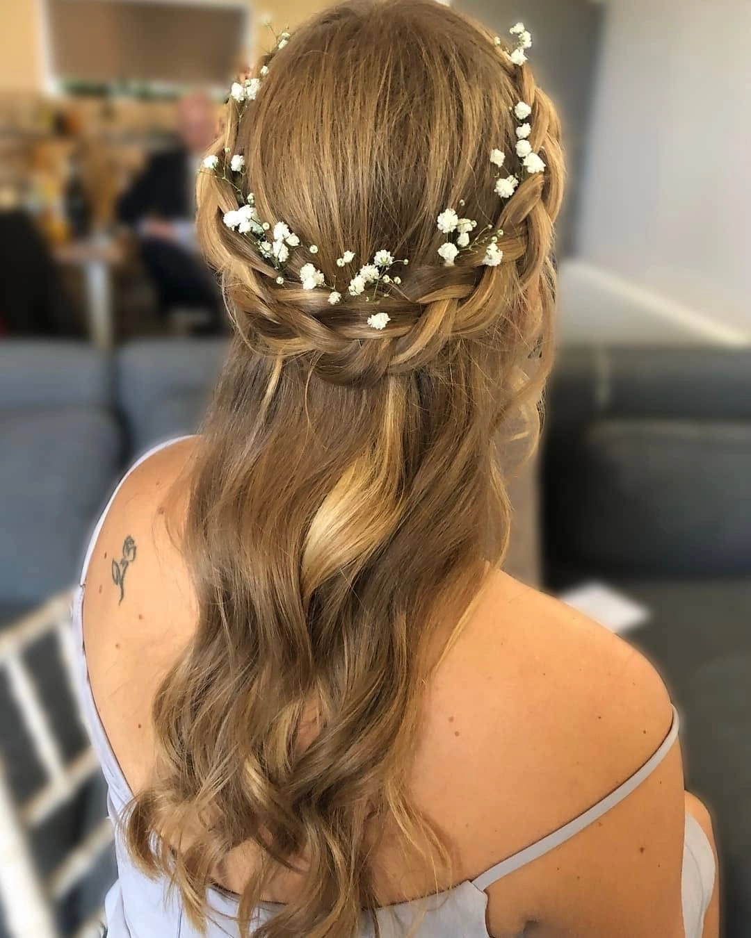 bridesmaid hairstyling Soft Braided Waves with Delicate Floral Details