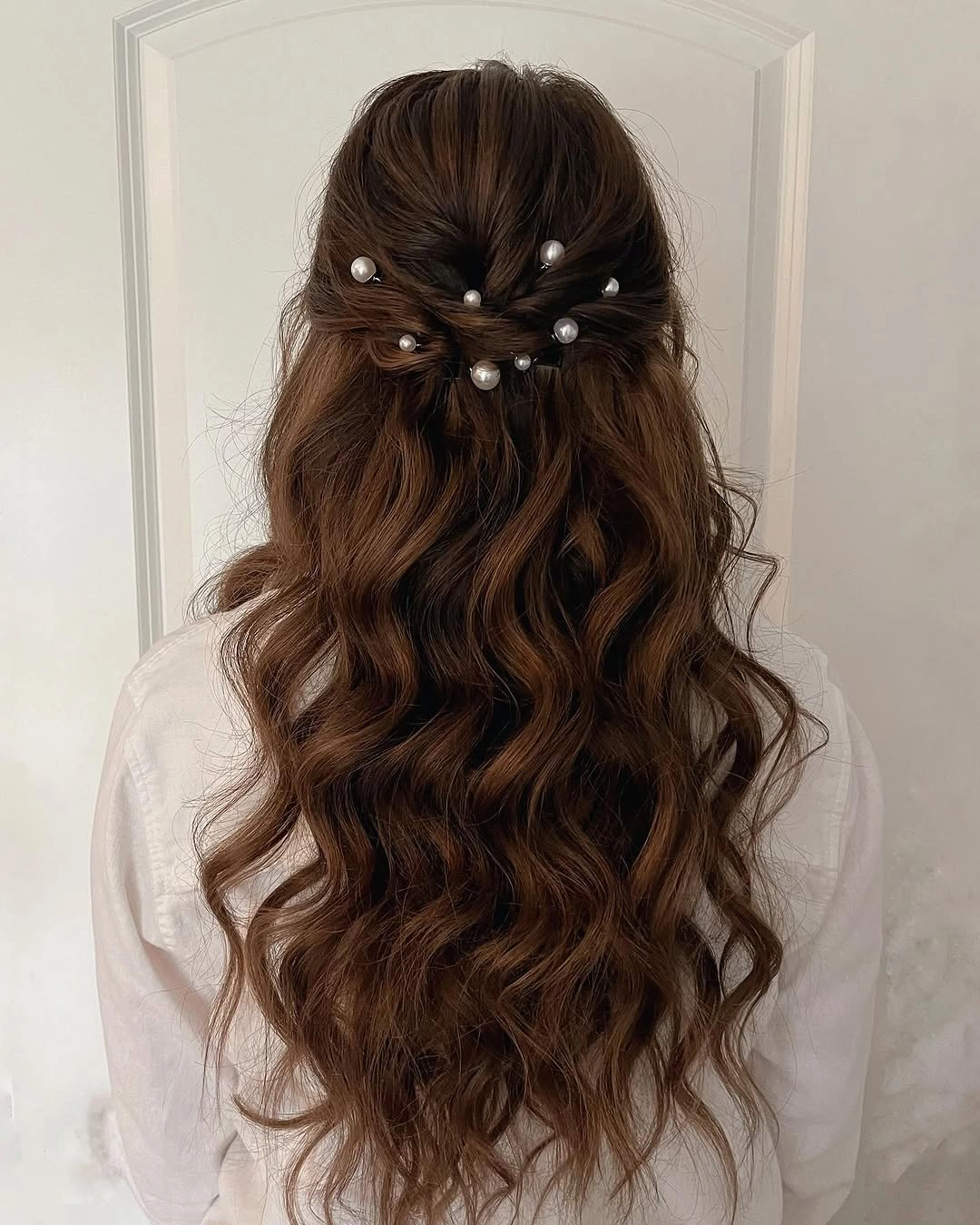 bridesmaid hairstyling Soft Brunette Waves with Delicate Pearl Details