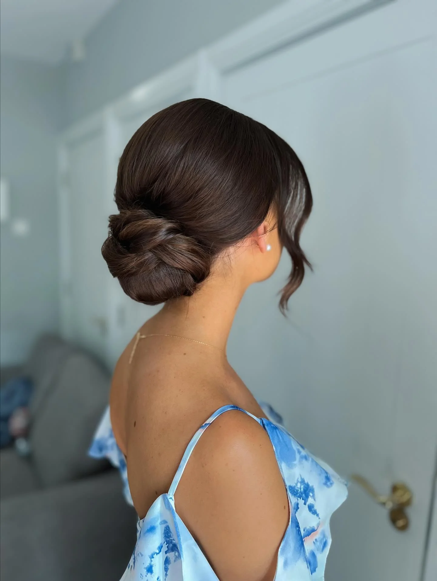 bridesmaid hairstyling Classic Low Chignon with Modern Simplicity