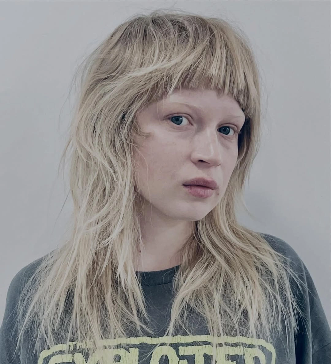 choppy medium layered hair Modern Platinum Shag With Blunt Fringe