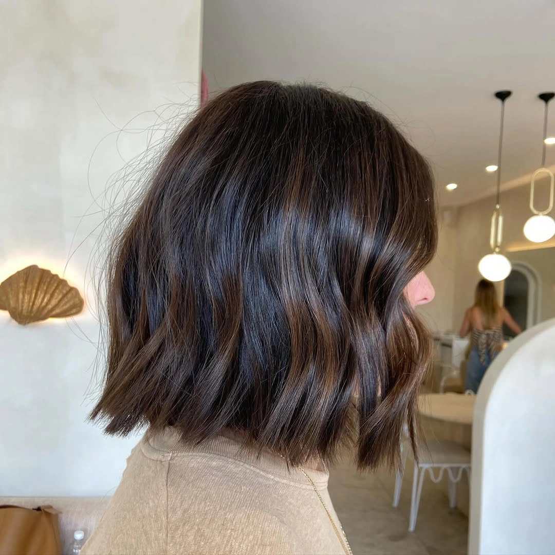 dimensional brunette hair color Short Wavy Brunette Lob From The Back