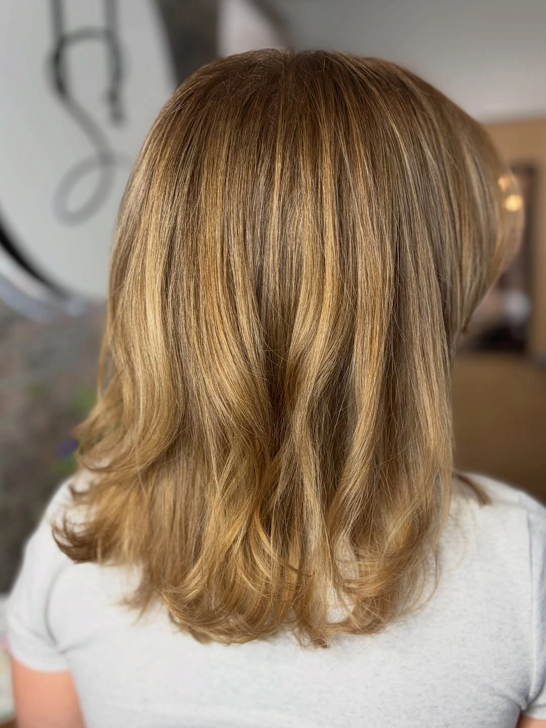 dirty blonde hair color Golden Dirty Blonde with Soft Flipped Layers