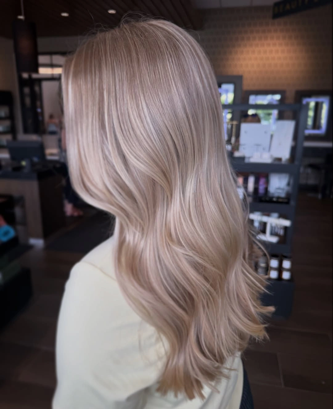 Fall blonde hair colour 2026 Soft Beige Blonde Waves With Cashmere Shine