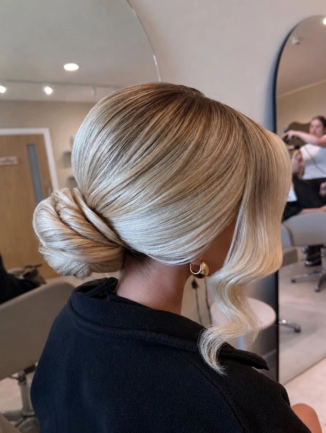 Fall blonde hair colour 2026 Elegant Low Bun With Glossy Scandinavian Blonde