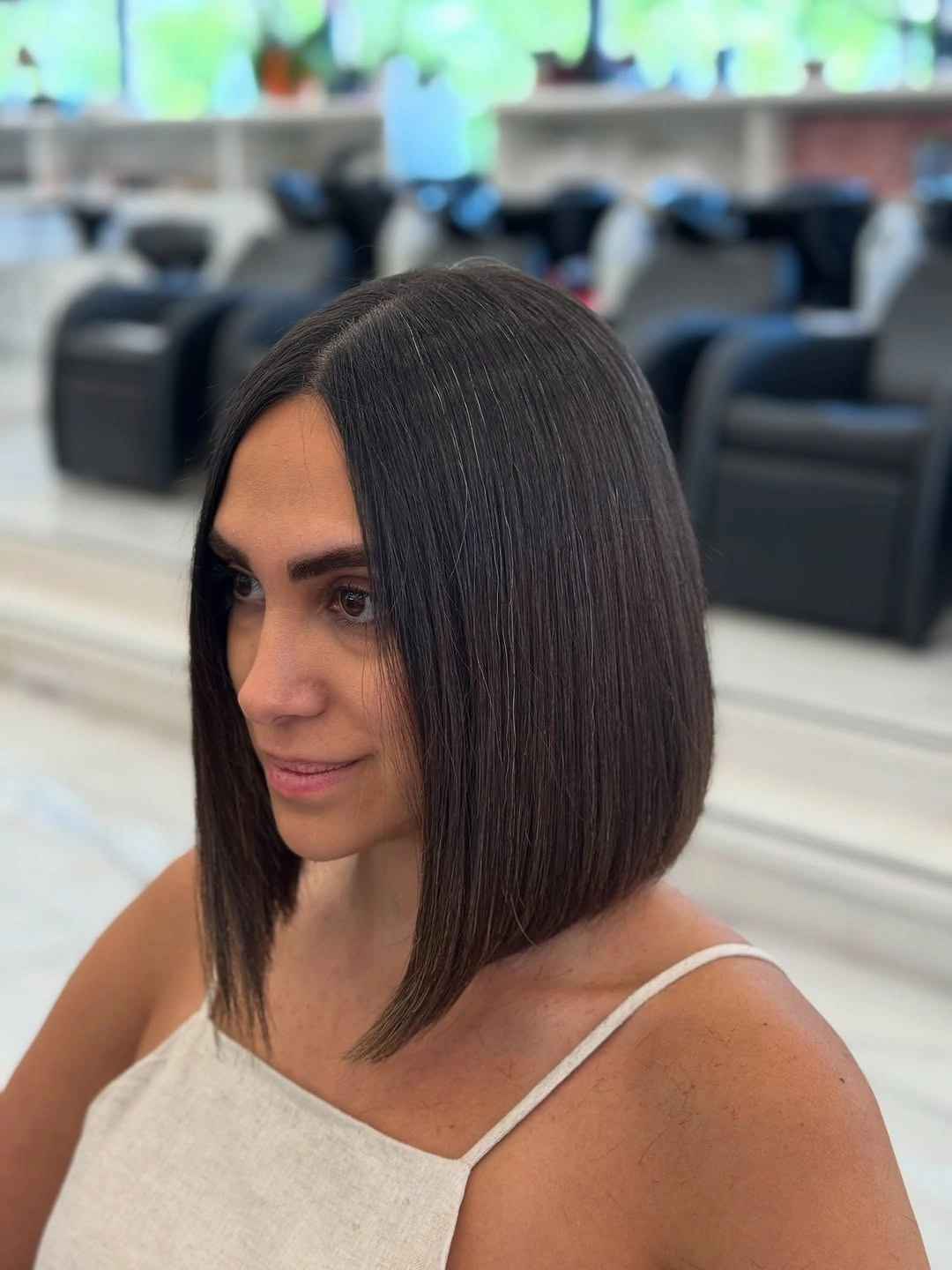 fall bob haircut ideas 2026 Long Angled Espresso Bob With Sleek Movement