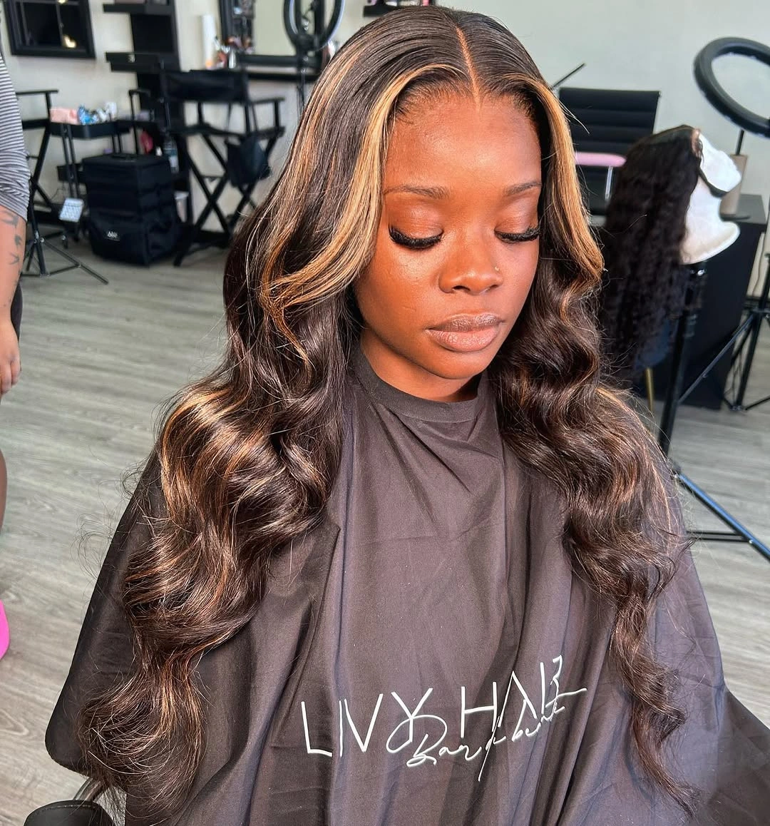 fall hair colors for black women 2026 Chocolate Waves with Caramel Face-Framing Highlights