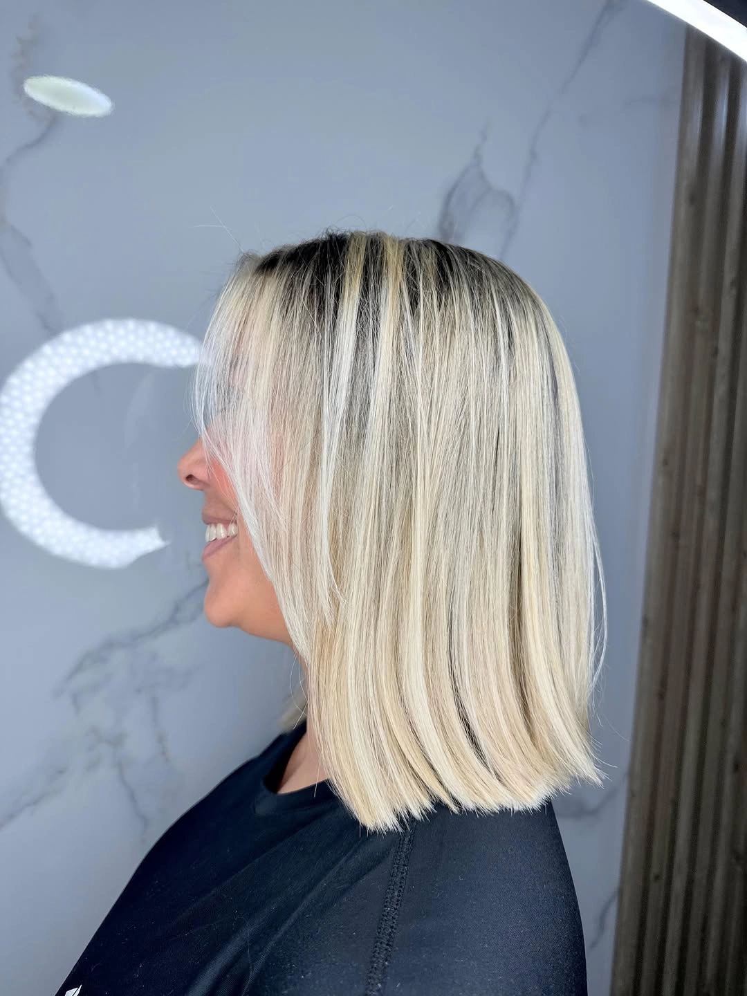 fall hair colour ideas 2026 Rooted Platinum Bob With Modern Contrast