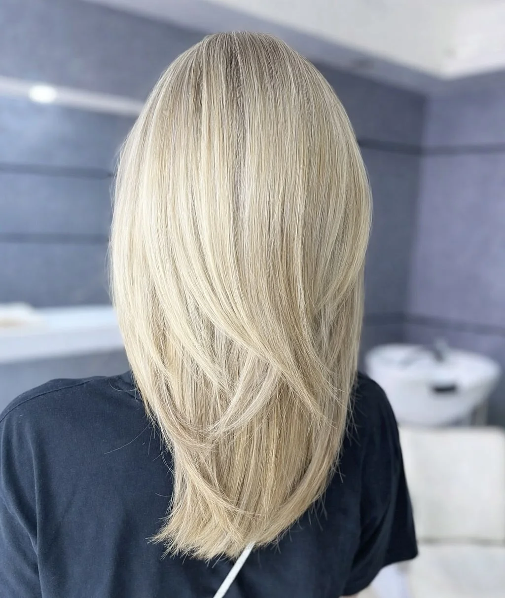 fall hair colour ideas 2026 Buttercream Blonde With Feathered Layers