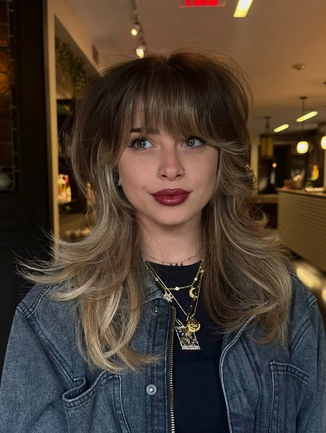 fall haircuts for women 2026 Soft Butterfly Layers with Curtain Bangs for Everyday Volume