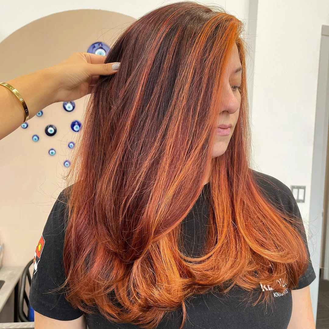 fall haircuts for women 2026 Rich Auburn Layers with Glowing Copper Face-Framing Highlights