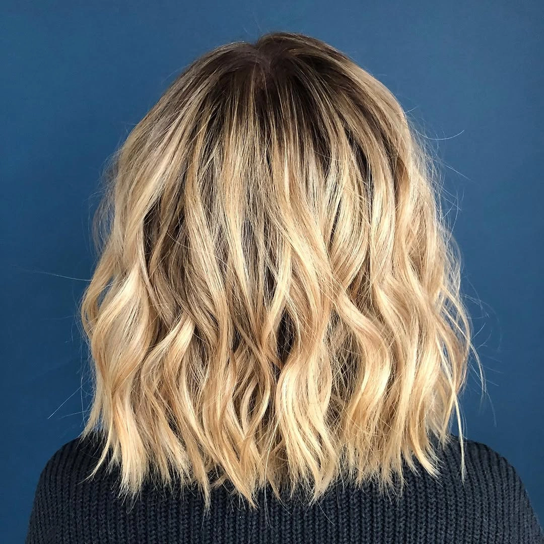 fall haircuts for women 2026 Soft Blonde Wavy Lob for Effortless Fall Style