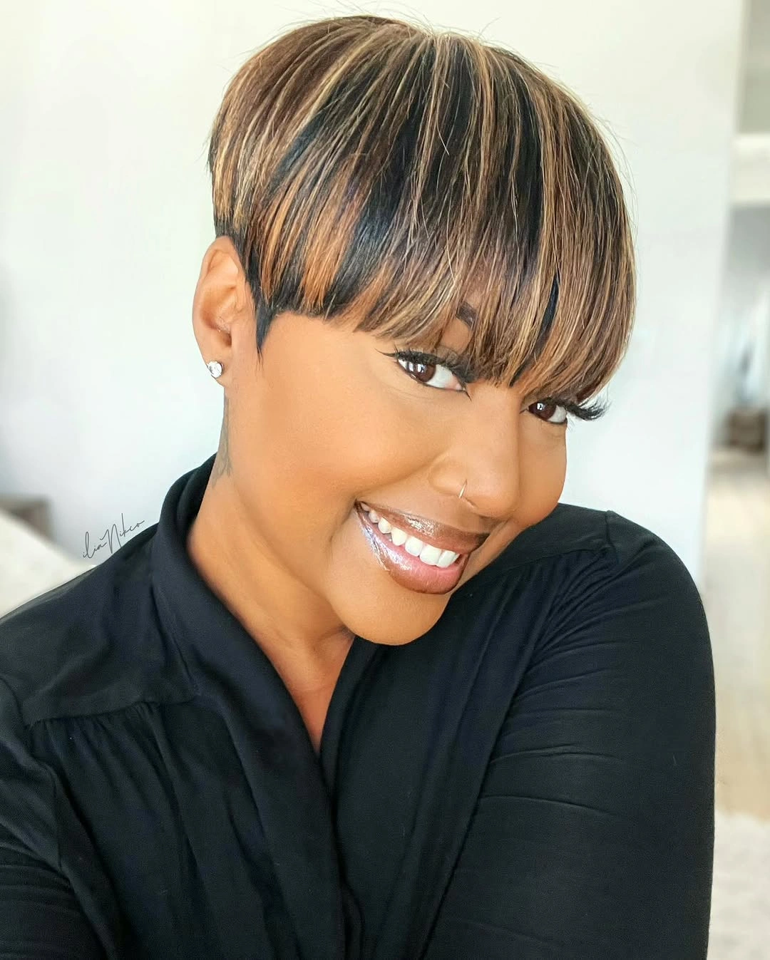 fall haircuts for women 2026 Modern Highlighted Pixie with Soft Full Bangs