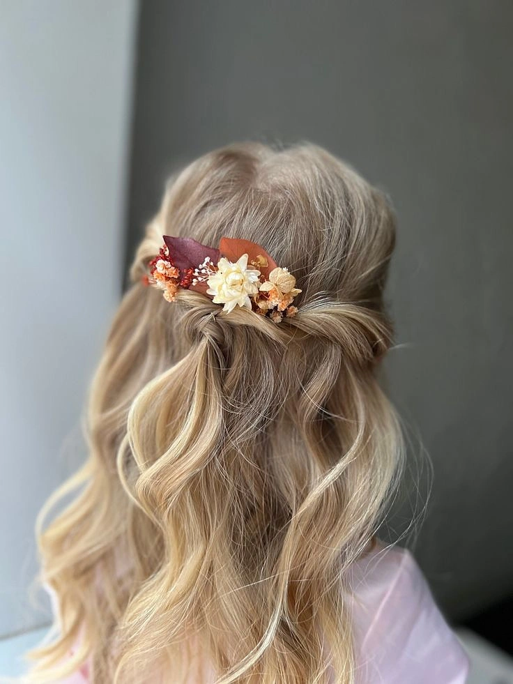 fall haircuts for women 2026 Romantic Half-Up Waves with Autumn Floral Details