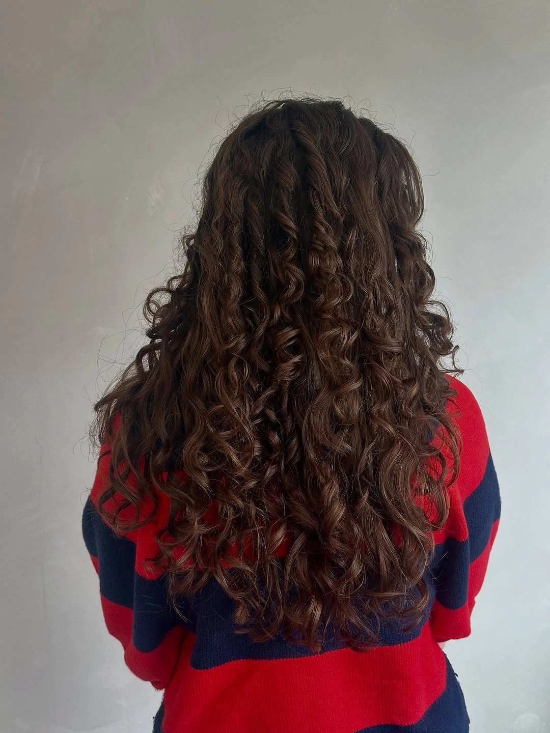 fall haircuts for women 2026 Defined Natural Curls with Long Rounded Layers